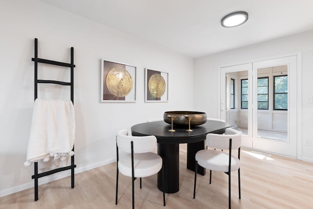 dining room with light hardwood / wood-style floors