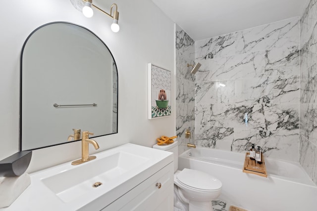 full bathroom featuring vanity, tiled shower / bath combo, and toilet