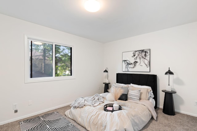 bedroom with light colored carpet