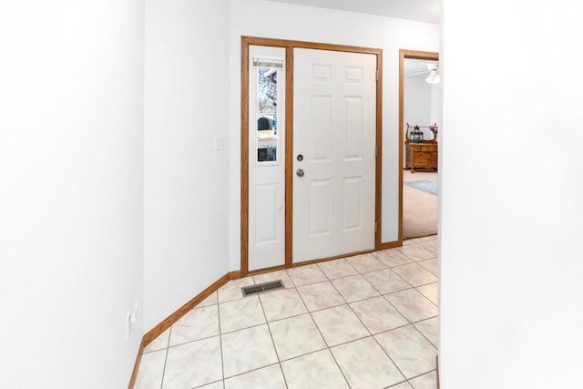 entryway featuring ceiling fan and light tile patterned flooring