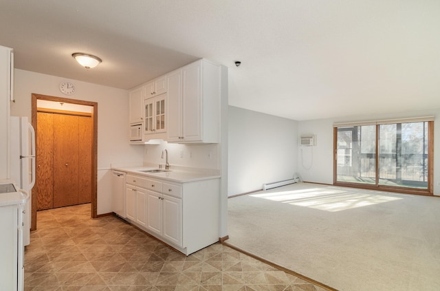 kitchen featuring baseboard heating, white cabinetry, sink, and white appliances