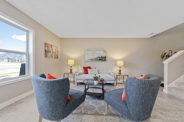 living room featuring a textured ceiling