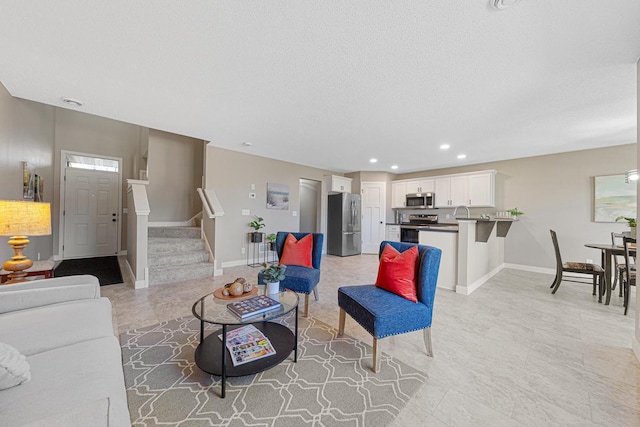 living room featuring a textured ceiling