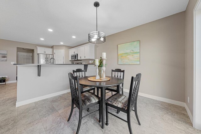 dining area featuring a chandelier