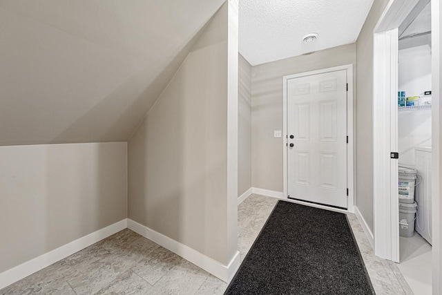 entrance foyer featuring vaulted ceiling