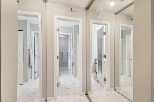 hallway featuring light tile patterned floors