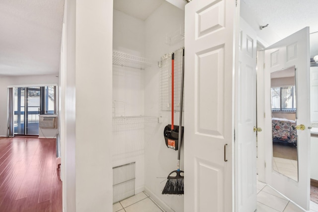 bathroom featuring tile patterned floors and a wealth of natural light