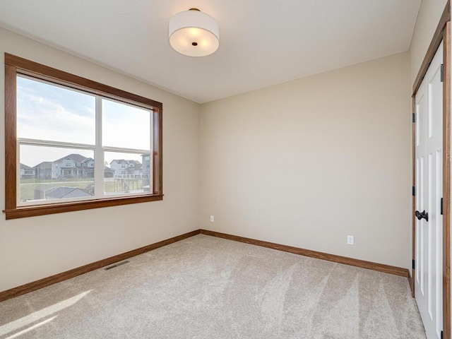 unfurnished bedroom featuring light colored carpet