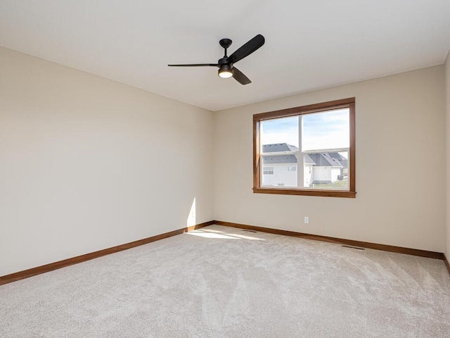 unfurnished room featuring carpet flooring and ceiling fan