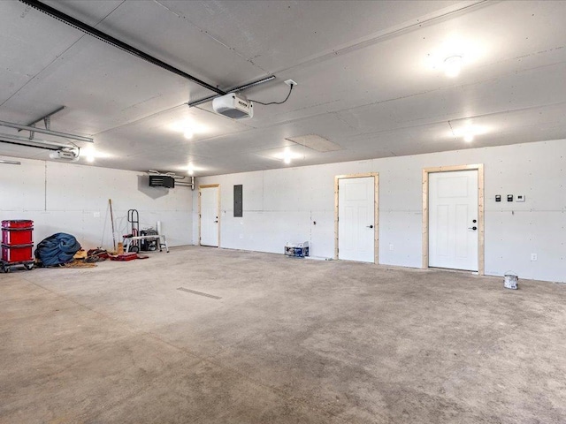 garage featuring a garage door opener and electric panel