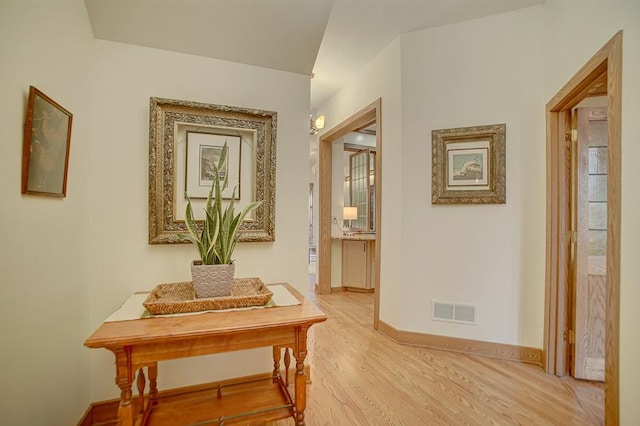 hall with light wood-type flooring