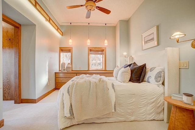 carpeted bedroom with ceiling fan