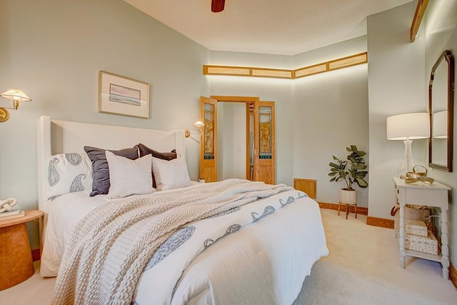 bedroom with light carpet and ceiling fan