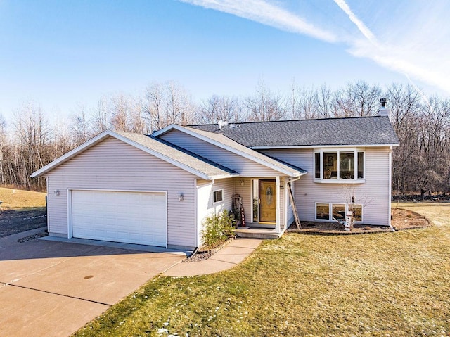 view of front of house featuring a garage and a front yard