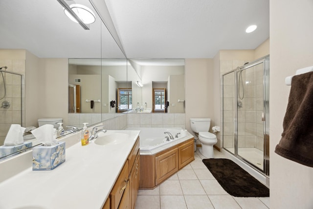 full bathroom with vanity, shower with separate bathtub, tile patterned flooring, and toilet