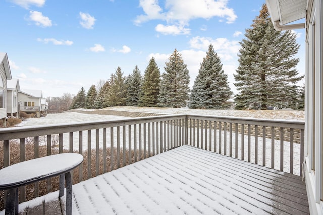 view of snow covered deck