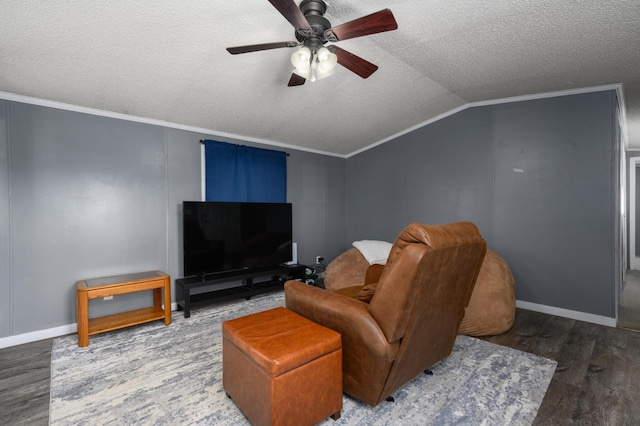 living room featuring ornamental molding, dark hardwood / wood-style floors, vaulted ceiling, and a textured ceiling