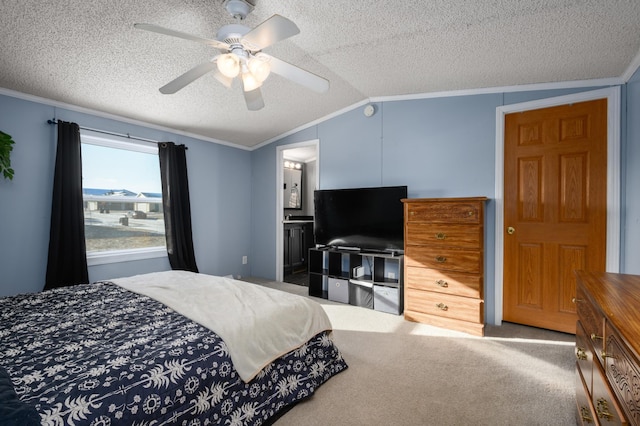 carpeted bedroom featuring connected bathroom, crown molding, vaulted ceiling, a textured ceiling, and ceiling fan