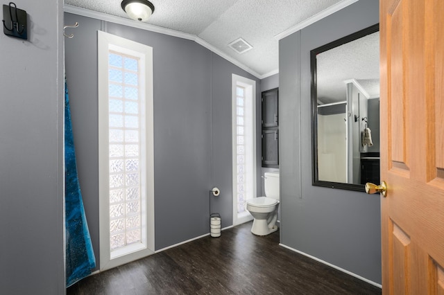 bathroom with vaulted ceiling, ornamental molding, hardwood / wood-style floors, and plenty of natural light