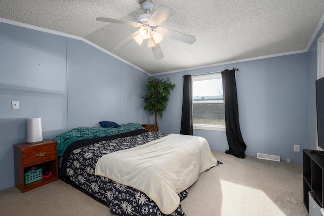 bedroom with ornamental molding, lofted ceiling, ceiling fan, and a textured ceiling