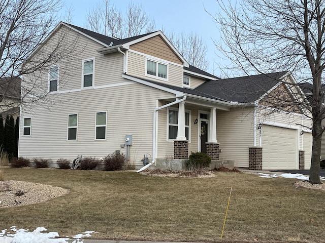 view of front facade featuring a front yard and a garage