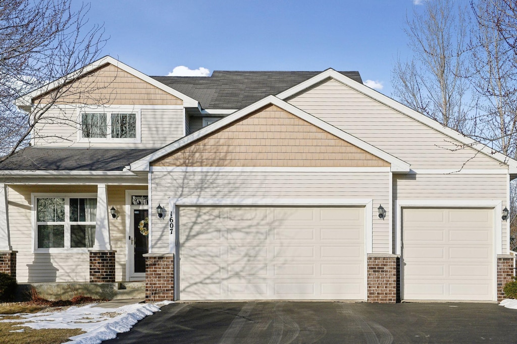 craftsman house with a garage