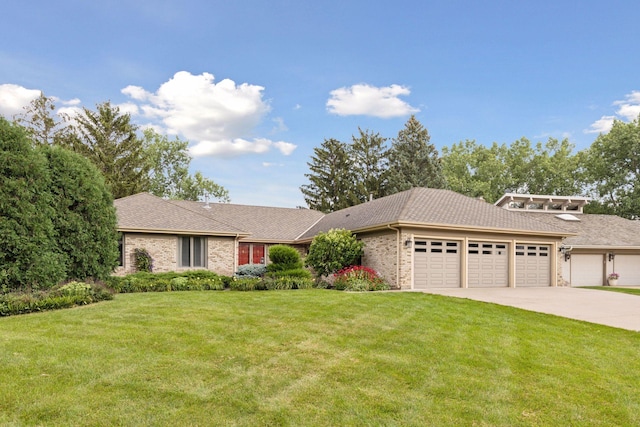 view of front of house with a front lawn, brick siding, driveway, and an attached garage