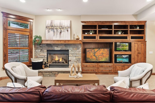 living room featuring a stone fireplace