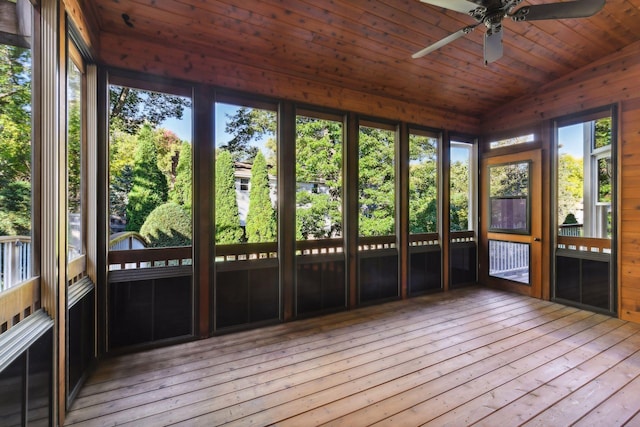 unfurnished sunroom with vaulted ceiling, ceiling fan, and wooden ceiling