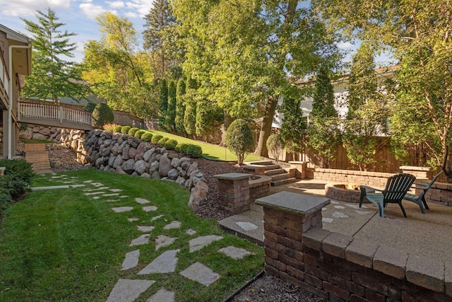 view of yard featuring a patio area and a fire pit