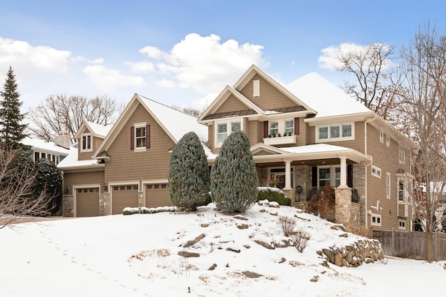 craftsman-style home featuring a garage and covered porch