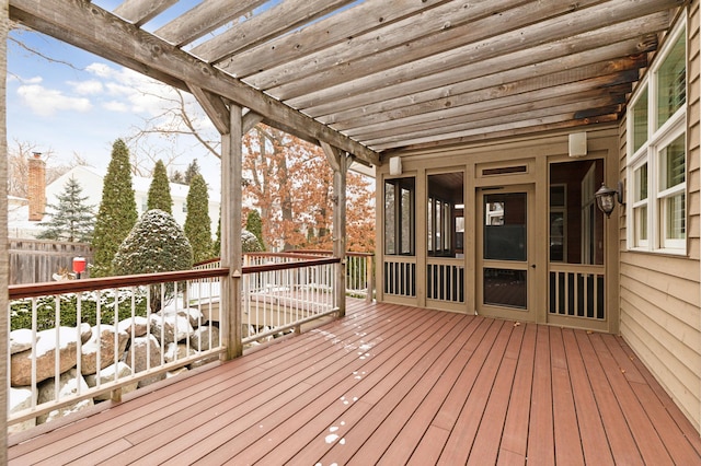 snow covered deck with a pergola