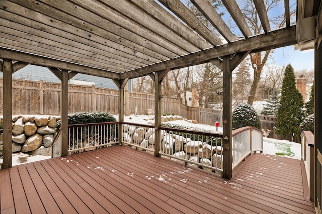 snow covered deck with a pergola