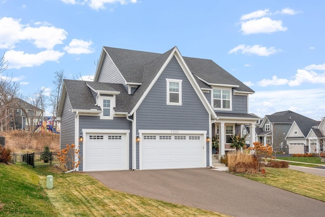 view of front facade with a front yard and a garage