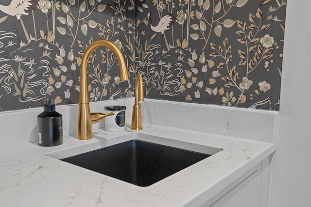 interior details featuring stone counters and sink