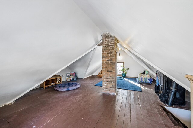 bonus room featuring hardwood / wood-style flooring and lofted ceiling