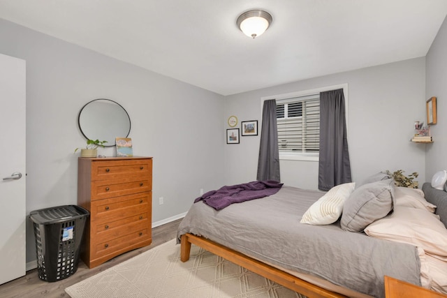 bedroom with light hardwood / wood-style floors