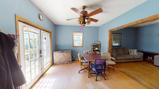 home office with ceiling fan, light hardwood / wood-style flooring, and a healthy amount of sunlight