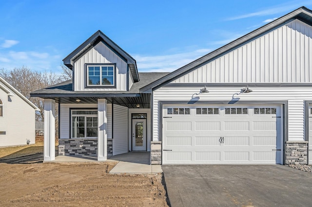 view of front of house featuring covered porch and a garage