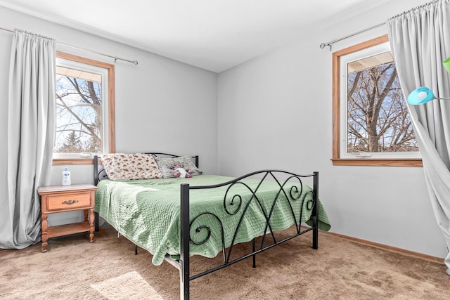 carpeted bedroom with baseboards