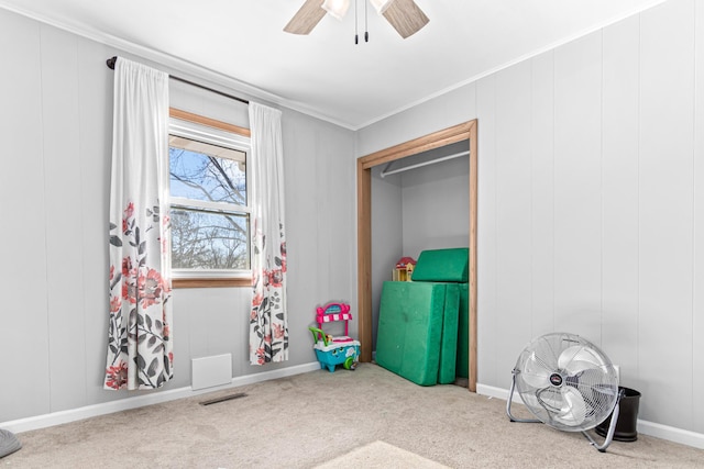 recreation room with visible vents, baseboards, ceiling fan, and carpet flooring