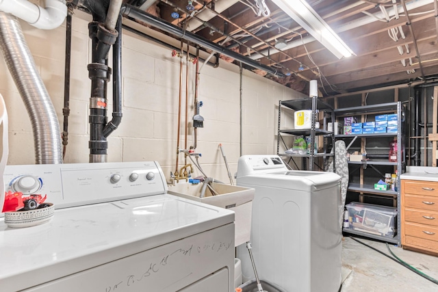 laundry room featuring washing machine and dryer and laundry area