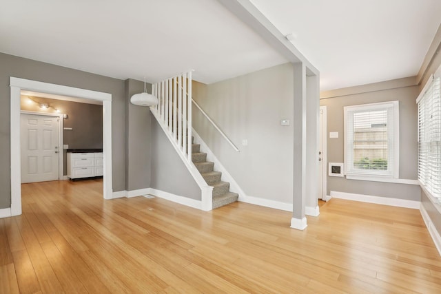 foyer entrance with wood-type flooring