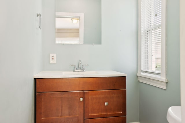 bathroom with vanity and toilet