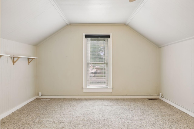 bonus room with carpet and vaulted ceiling