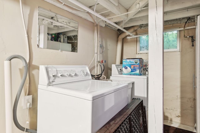 washroom featuring washing machine and clothes dryer