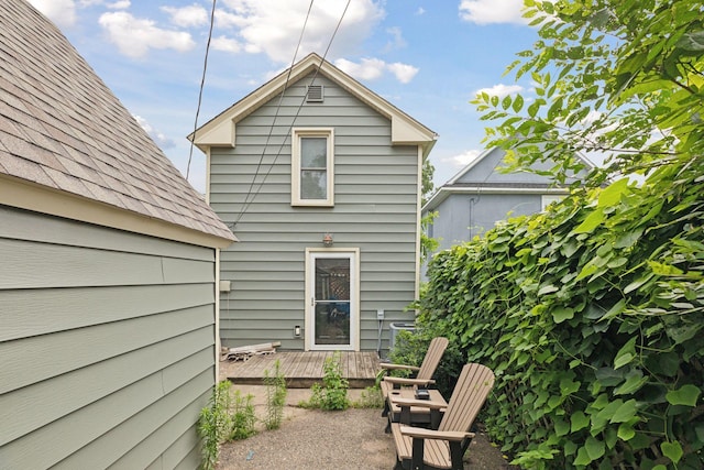 back of property with a patio area and a deck