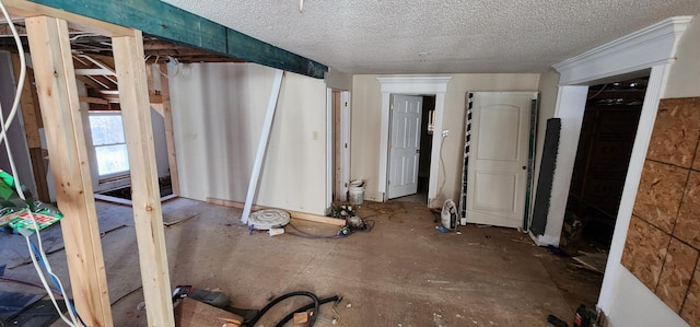 miscellaneous room with a textured ceiling