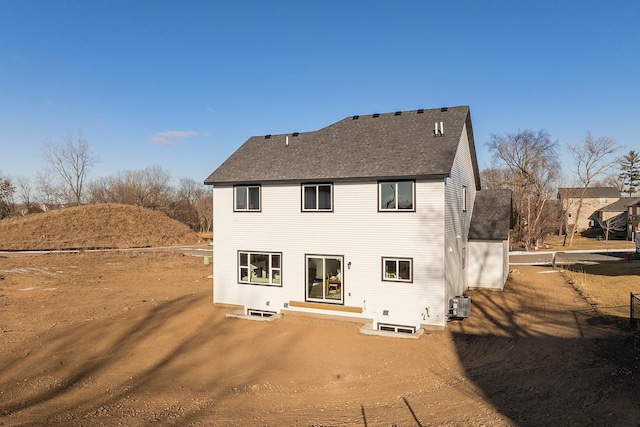 back of house with central AC unit