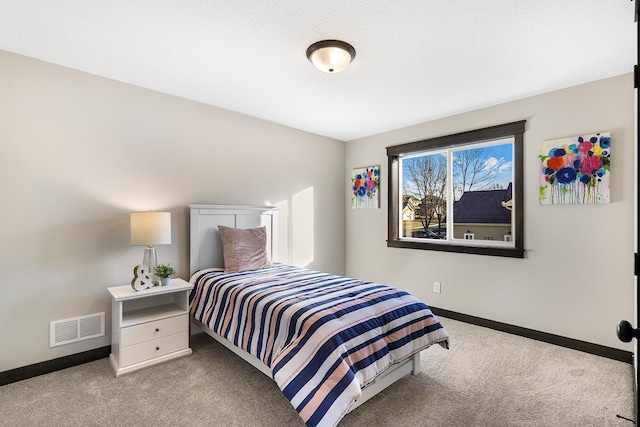 bedroom featuring light colored carpet